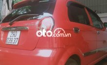 Ảnh chụp ngoại thất xe ô tô Chevrolet Spark VAN 2014 màu đỏ đang rao bán tại Hà Nội