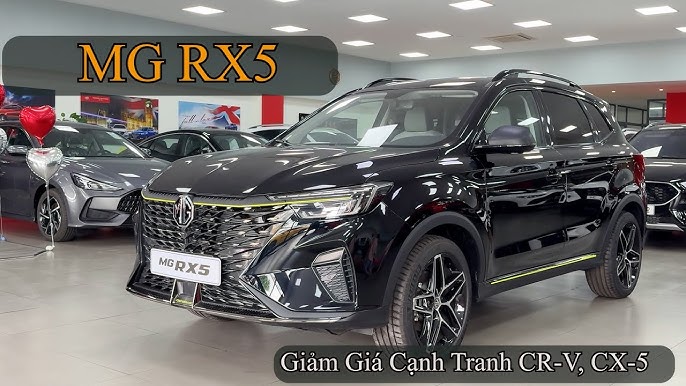 Thiết kế đầu xe SUV hiện đại, đèn pha LED sắc nét của một trong hai dòng Mazda CX-5 hoặc Mitsubishi Outlander.